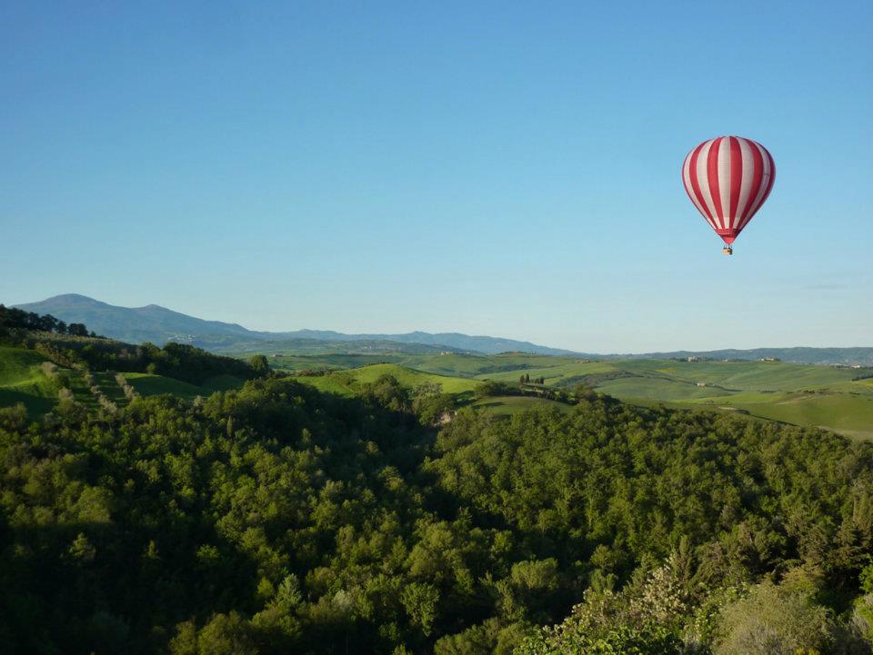 Balloon over tuscan hills